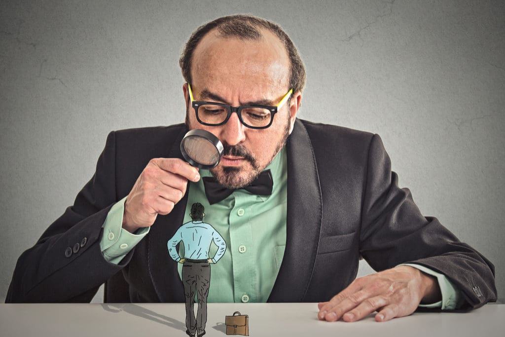 business man looking at animated tiny business man