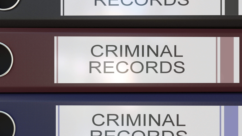 stack of criminal record binders