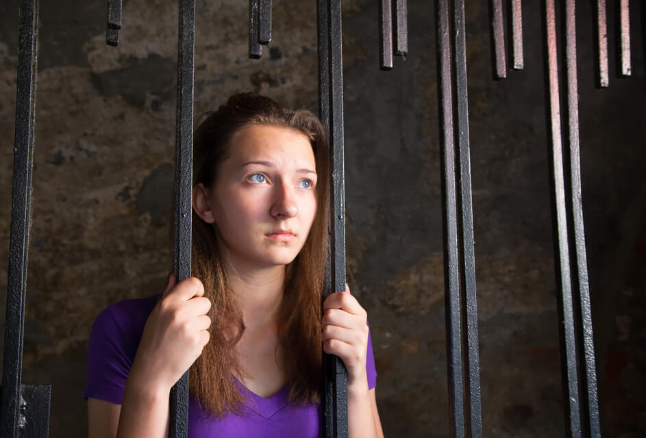 woman in jail thinking how to expunge a criminal record
