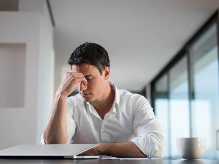 man worried researching how to find your mugshot
