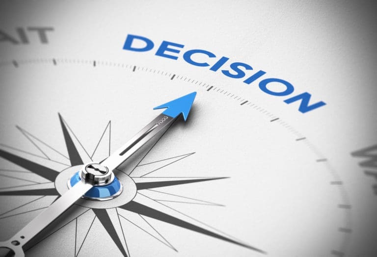 A compass with the word decision on it.