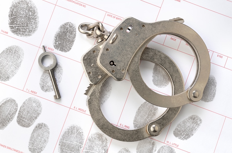 Looking for how to find mugshots online for a police report? Check out the handcuffs and fingerprints in the document.