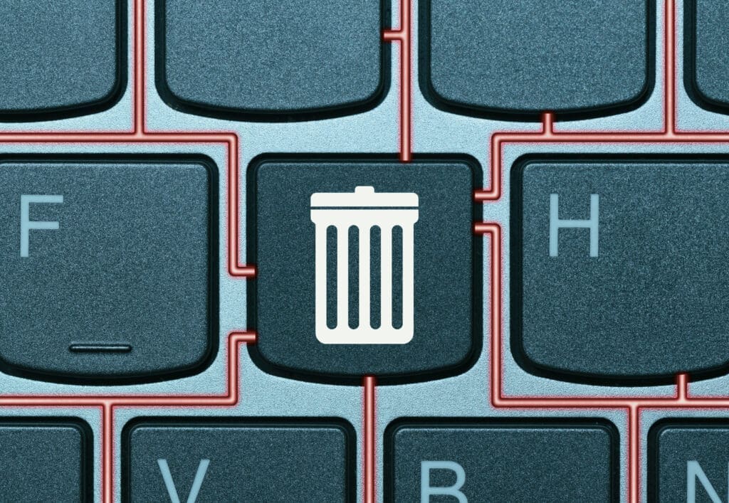 A close-up image of a keyboard with a red circuit pattern. A key between the "F" and "H" keys features a trash can icon.